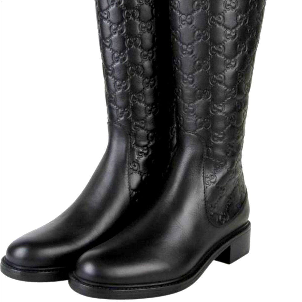 - Gucci black micro leather boots